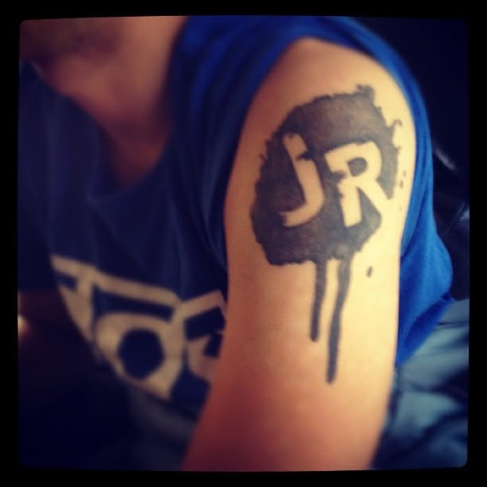 Neil's JoyRiders logo tattoo